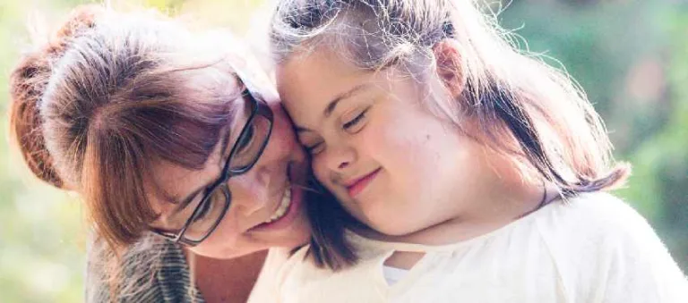Mother and daughter sharing a hug